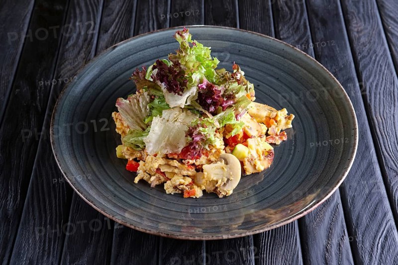 Scrambled eggs with mushrooms and romaine