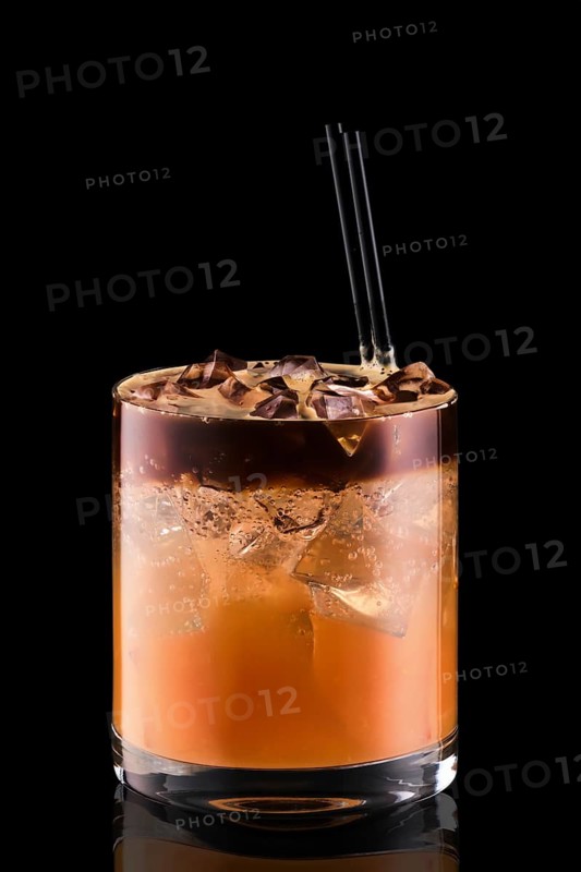 Espresso tonic with grapefruit juica isolated on black background