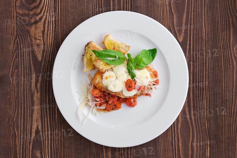 Top view of roasted chicken fillet with tomato cherry