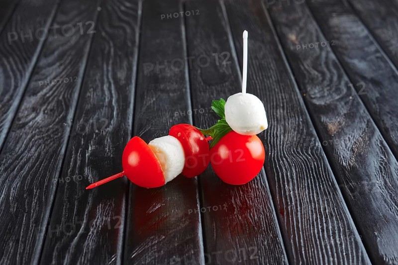 Appetizer for reception. Cherry tomato with small ball of mozzarella