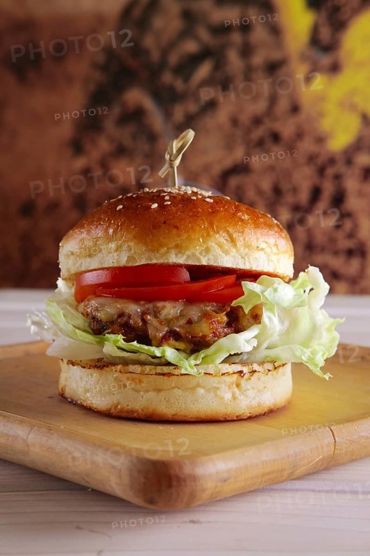 Bacon burger on wooden plate