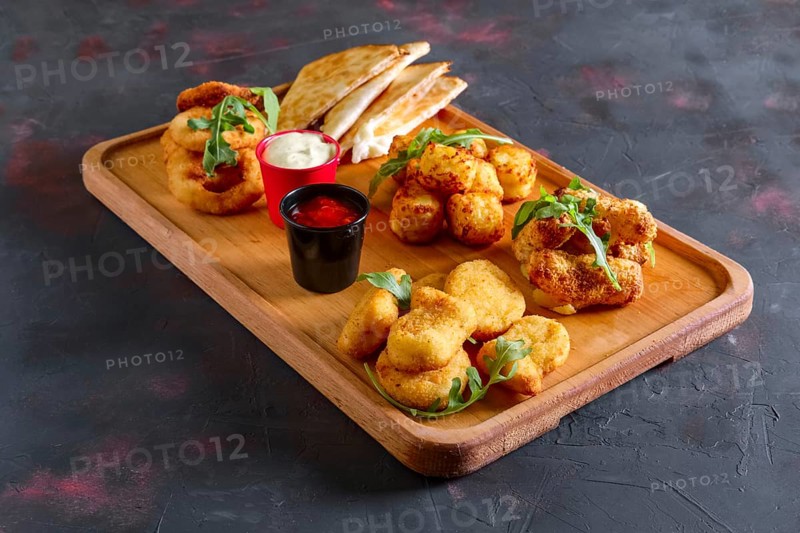 Wooden plate with snack for beer