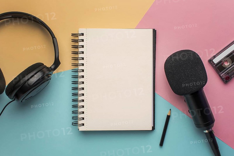 Copy space notepad with mic headphones