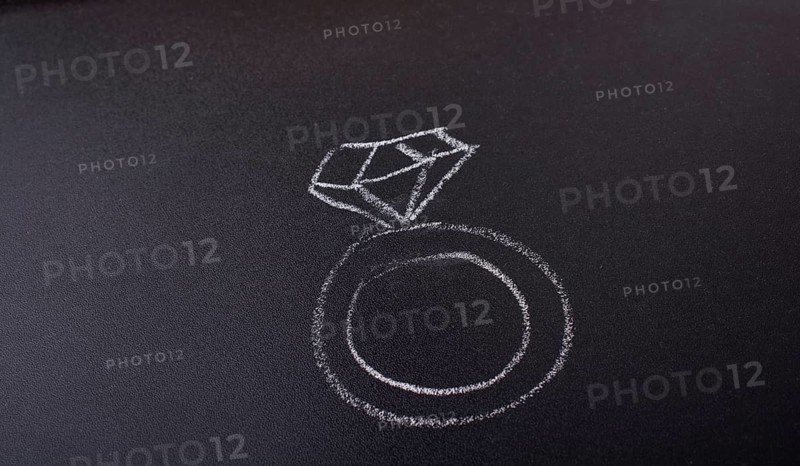 Diamond ring drawn on a blackboard in view