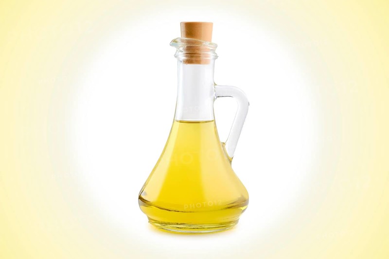 Jar with vegetable oil on circular gradient background