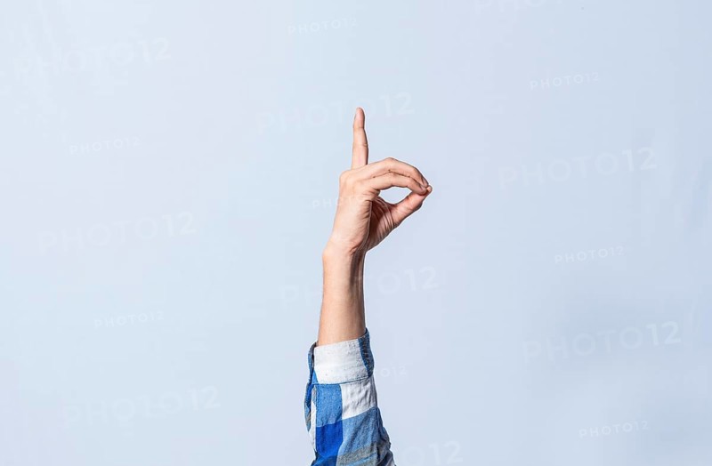 Hand gesturing the letter D in sign language on isolated background. Man hand gesturing the letter D of the alphabet isolated. Letters of the alphabet in sign language