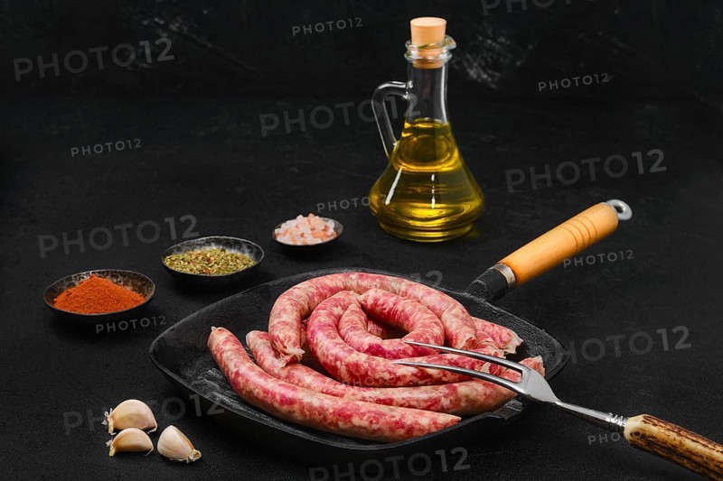 Thin beef sausages on grill pan