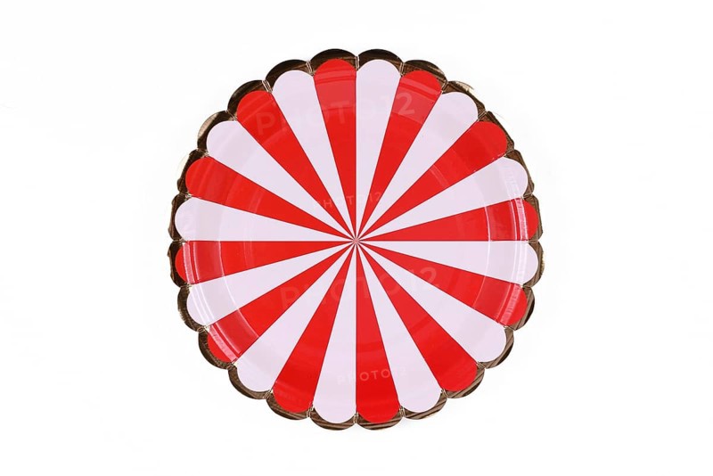 Red and white striped party paper plate isolated on white background