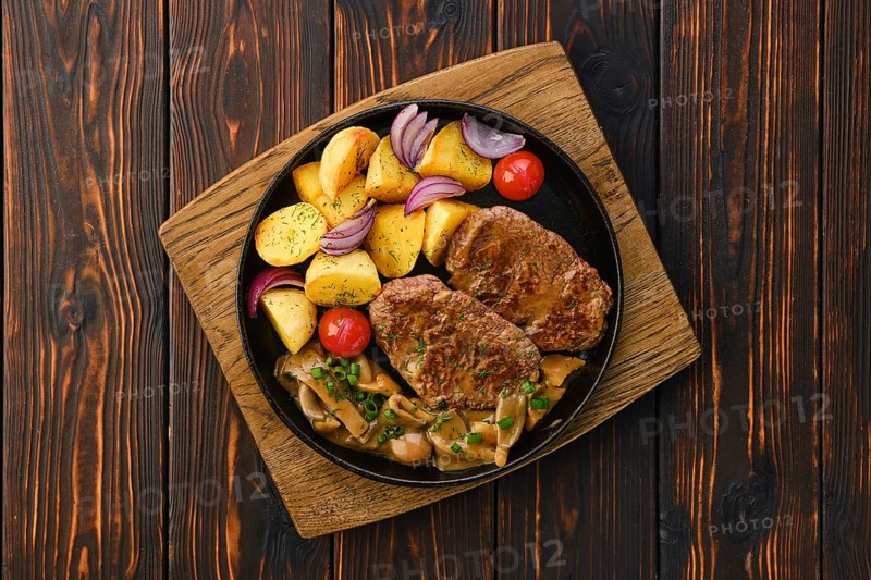 Top view of plate with fried pork fillet