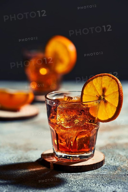 Cocktail old fashioned with hard light and harsh shadows