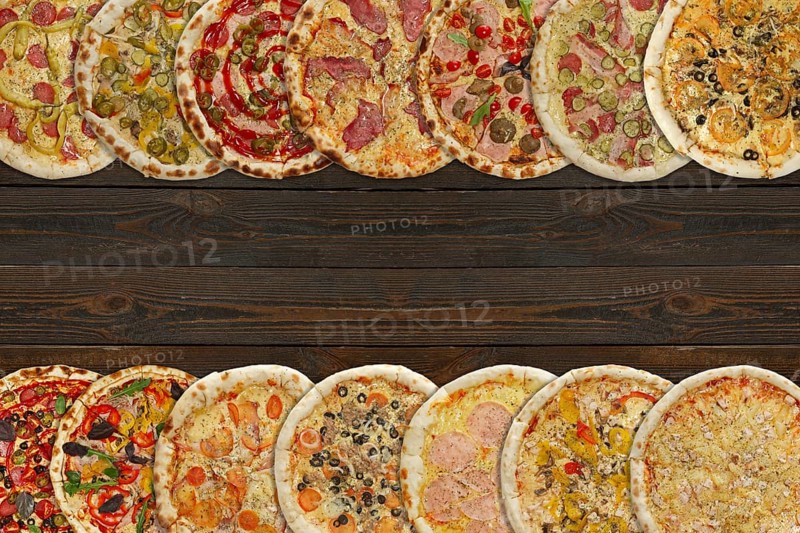 Horizontal collage of different baked pizzas on dark wooden table. Top view