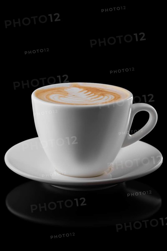 Big ceramic cup of cappuccino isolated on black background