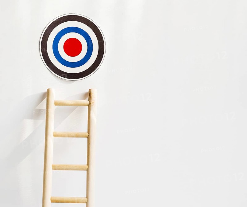 Front view target with wooden ladder copy space