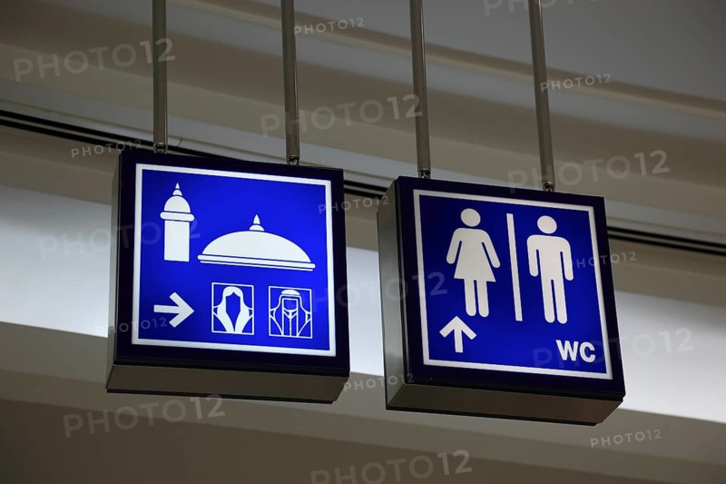 Signs for mosque and toilets in the City Centre Doha