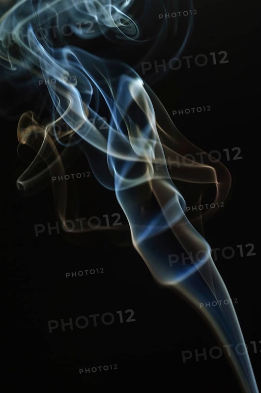 Trajectory of incense smoke in the air showing different shapes. France