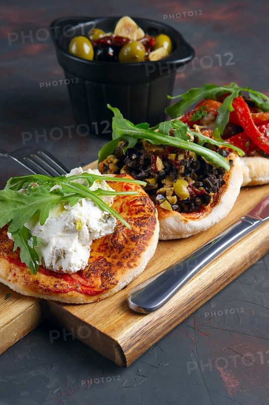 Delicious tapas set. Small sandwiches with goat cheese