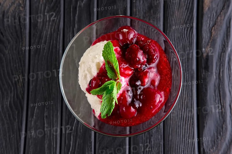Ice cream with cherry and raspberry jam