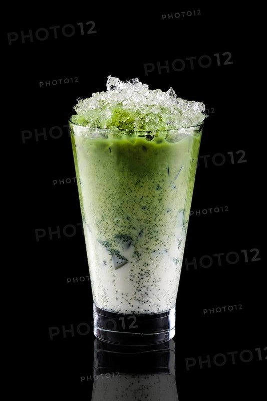 Iced matcha tea and crushed ice isolated on black background