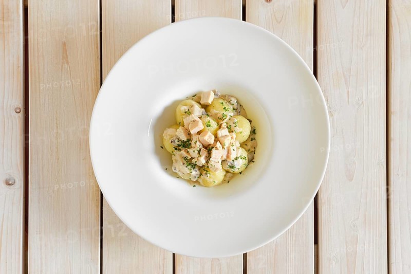 Top view of potato dumplings with boiled chicken meat