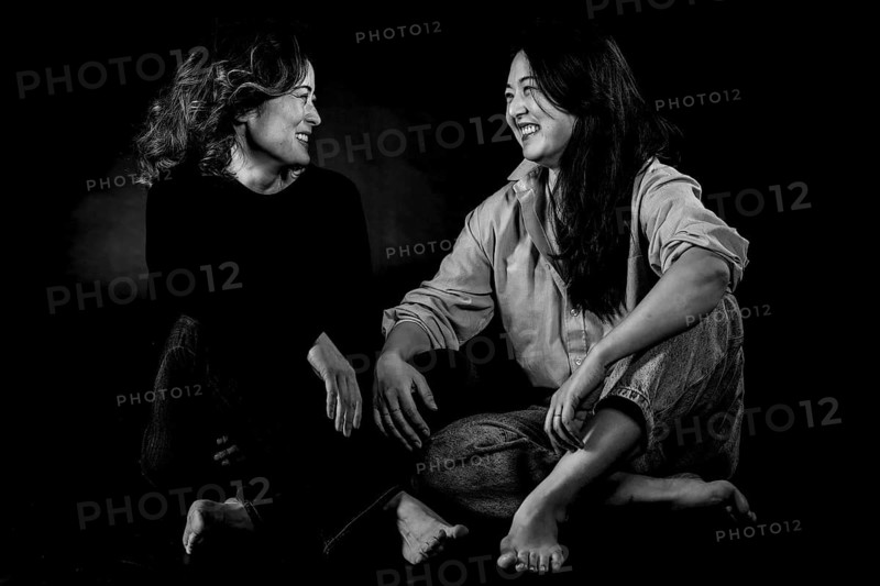 Two Asian woman sitting