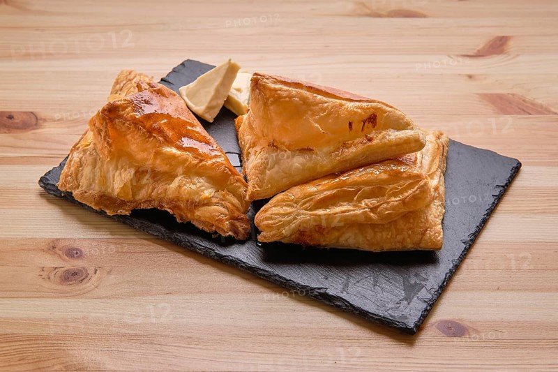 Puff pastry with cheese on slate plate