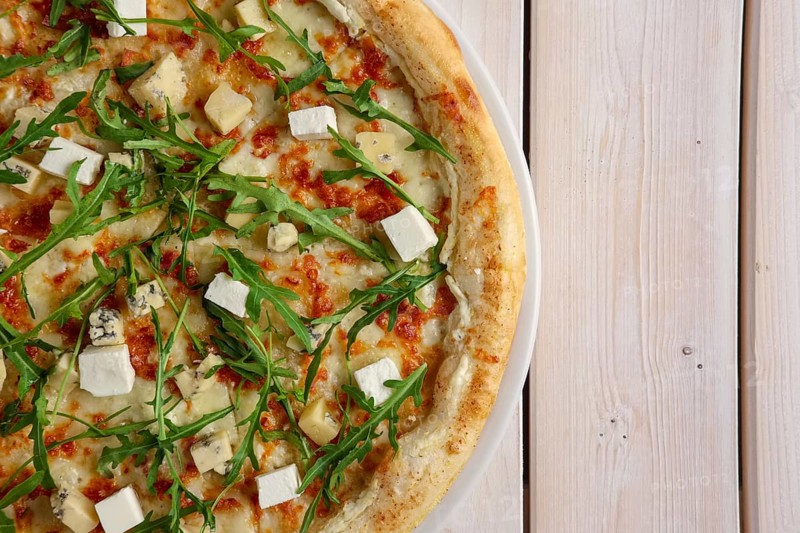 Half of pizza with blue cheese