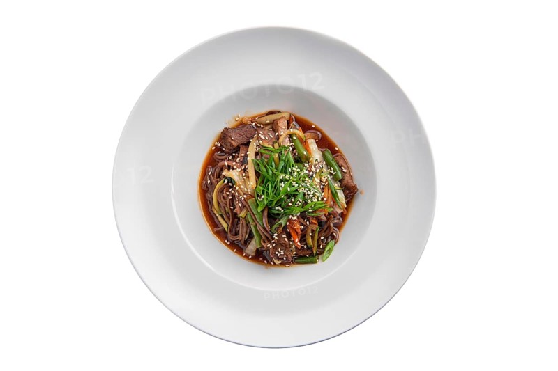 Top view of wok with beef and green beans isolated on white background