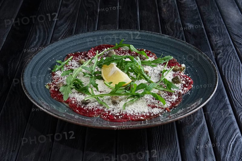 Beef carpaccio with grated cheese