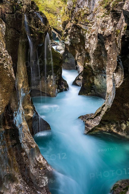 Mountain river Soca flows through narrow canyon
