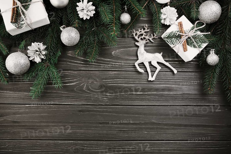 Christmas composition green fir tree branches with small deer