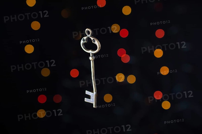 Retro style key on a bokeh light background