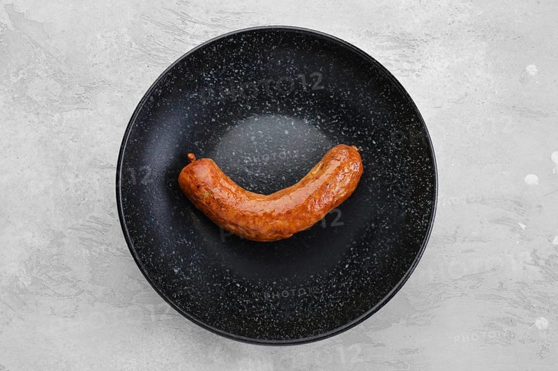 Fried bavarian sausage on a plate