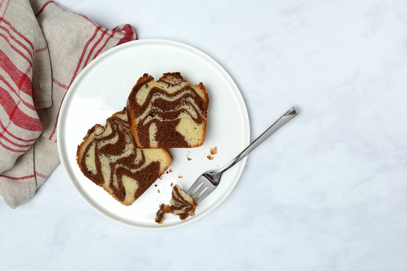 Two pieces of marble cake on plate