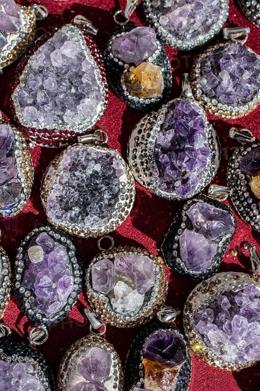 Raw violet amethyst rock as a necklace
