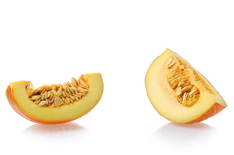 Two pieces of pumpkin isolated on white background
