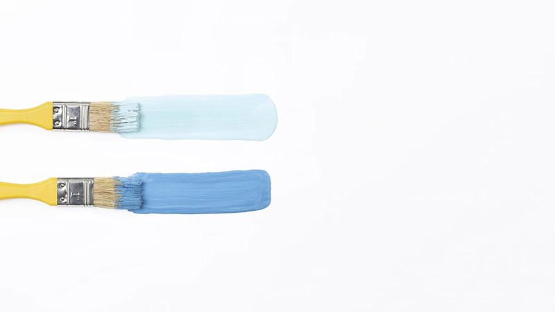 Top view yellow brushes with blue paint. Resolution and high quality beautiful photo