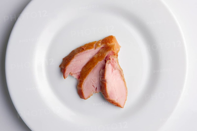 Top view of slices of ham on a plate