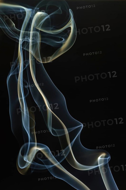 Trajectory of incense smoke in the air showing different shapes. France