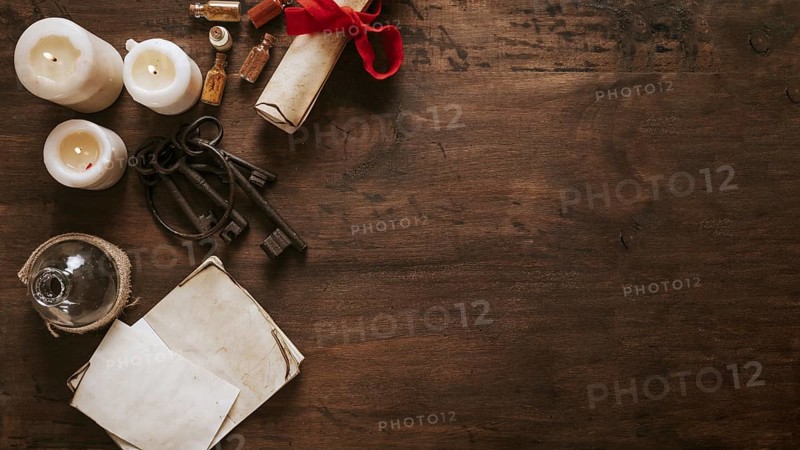 Keys parchment near candles