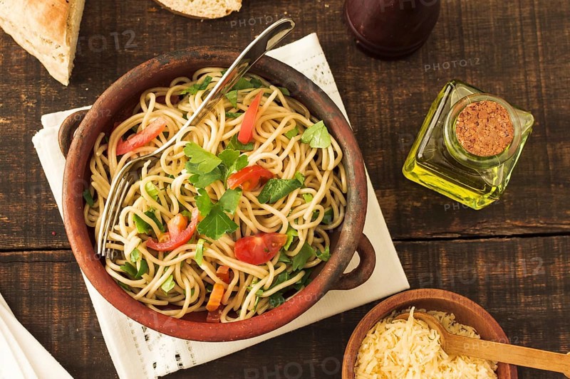 Tomatoes coriander toppings spaghetti pasta earthenware. Resolution and high quality beautiful photo