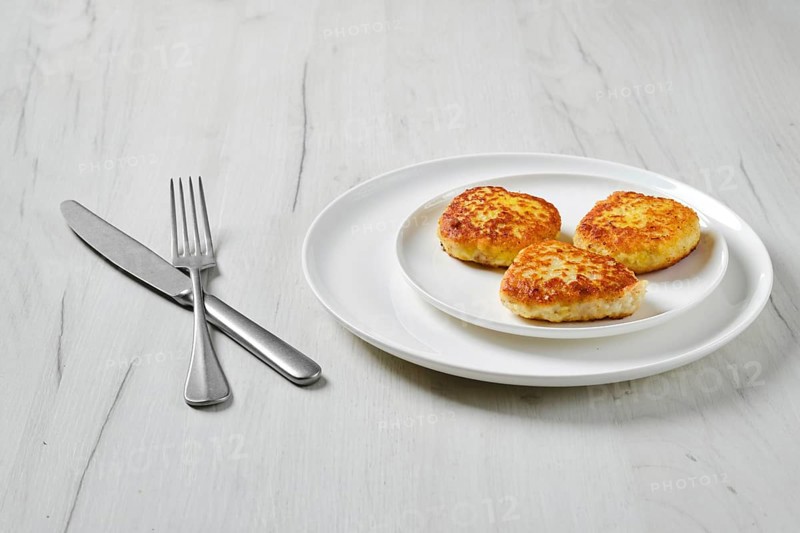 Fried squid cutlet in breading on a plate