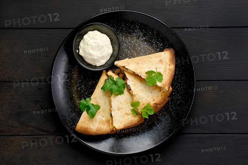Top view of quesadilla with chicken meat