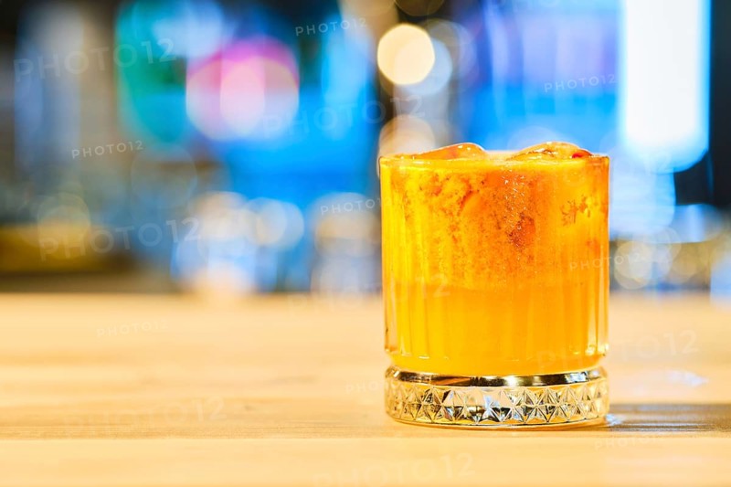 Cold cocktail with tequila and sea buckthorn