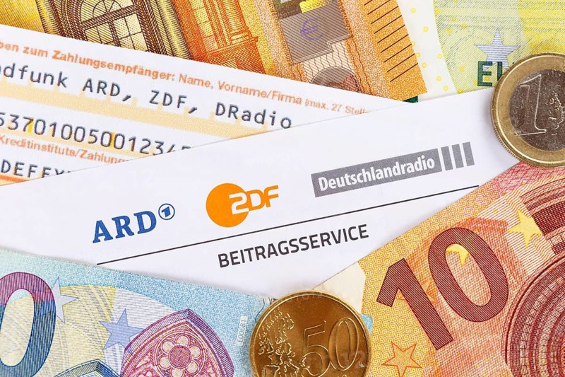 Contribution service of ARD and ZDF Rundfunkgebuehr GEZ with money in Stuttgart