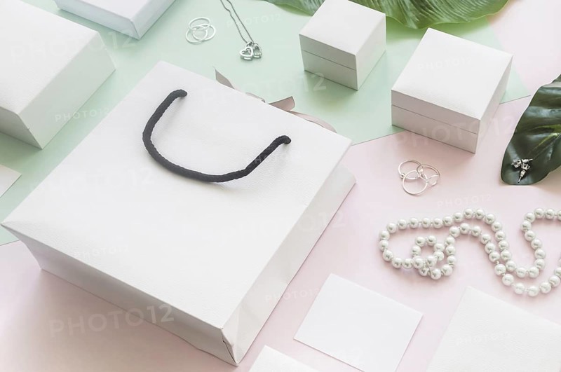 White shopping bag gift boxes with jewelry colored background. Resolution and high quality beautiful photo