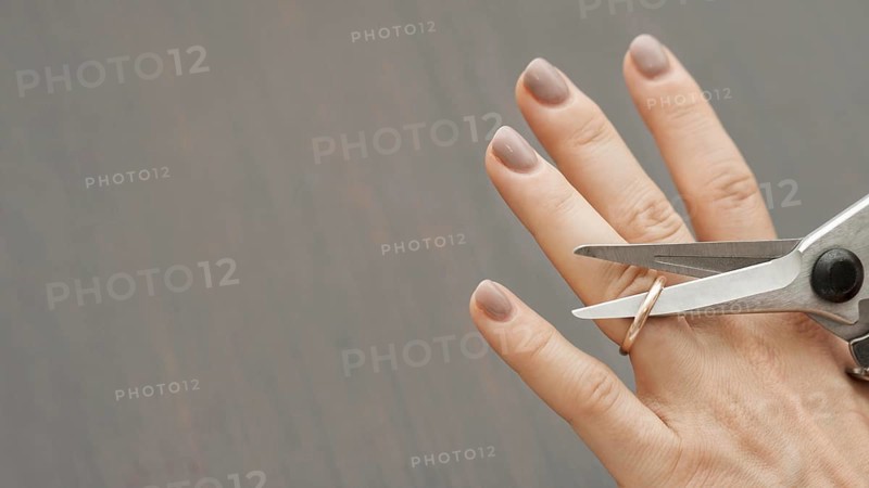 Top view scissors cutting wedding ring. Resolution and high quality beautiful photo