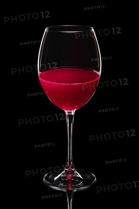 Glass of white wine isolated on black
