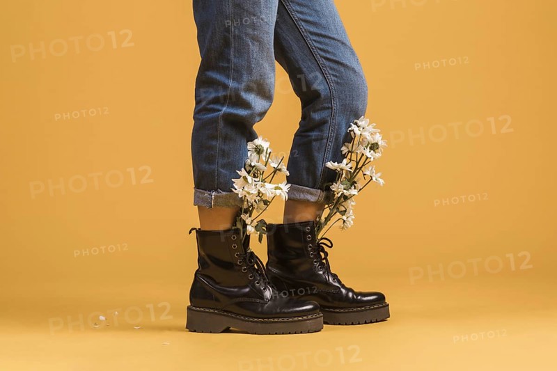 Woman legs wearing boots with flowers inside. Resolution and high quality beautiful photo