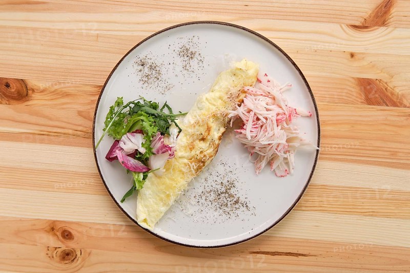 Omelette with crab meat and salad