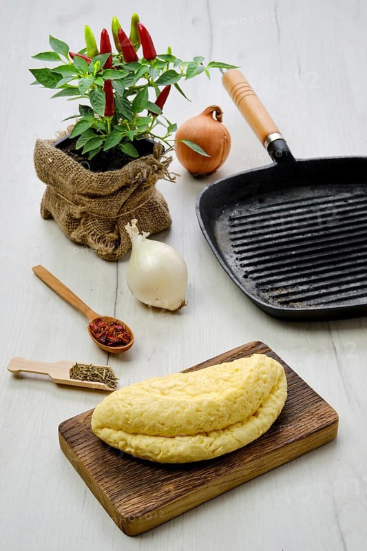 Homemade cheese for frying on cast iron grill pan
